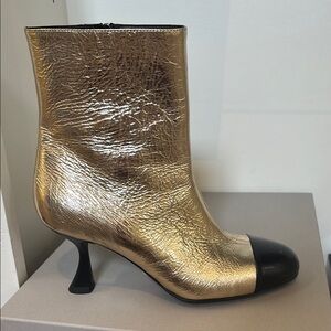 Gold and Black Heeled Boots with Textured Finish